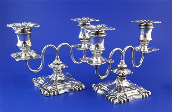 A pair of late Victorian silver dwarf two branch, two light candelabra, weighted.